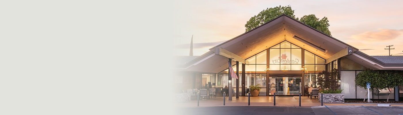 Front view of Garden City facility entrance at sunset